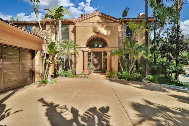 view of exterior entry featuring a garage