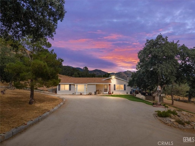 view of front of house featuring a garage and a mountain view