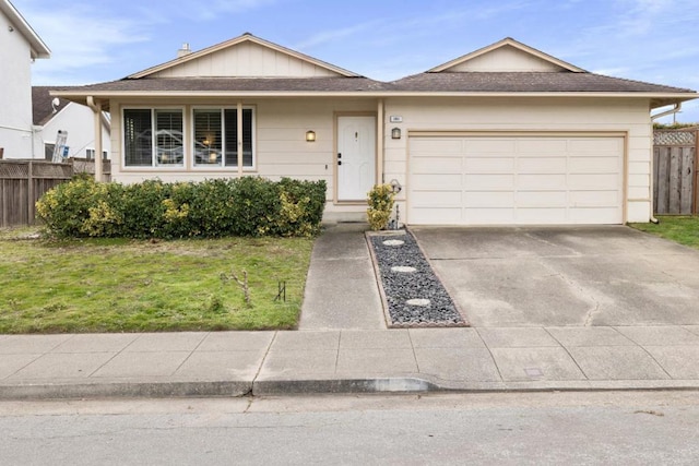 ranch-style house with a garage and a front yard