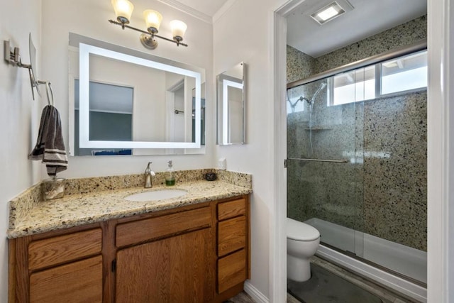 bathroom featuring an enclosed shower, vanity, and toilet