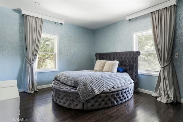 bedroom featuring dark hardwood / wood-style flooring