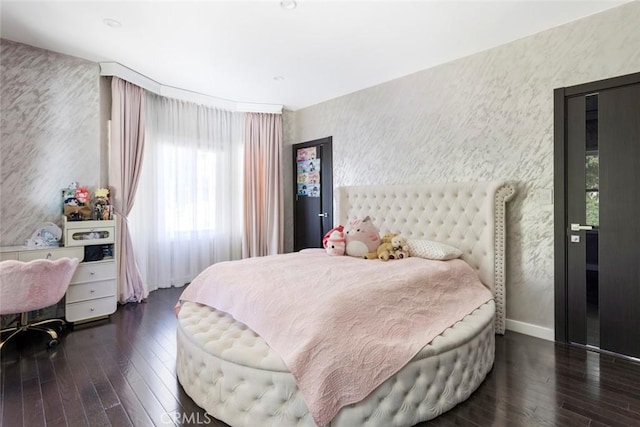 bedroom with dark wood-type flooring