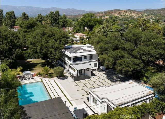 birds eye view of property featuring a mountain view