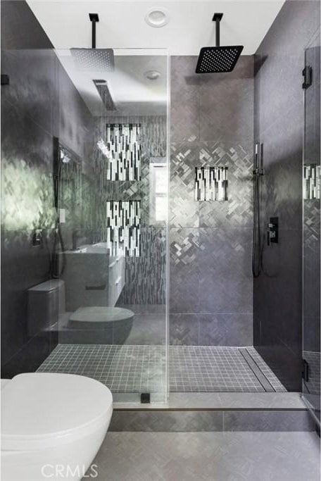 bathroom with a shower with door