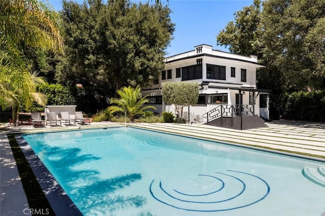 view of swimming pool featuring a patio