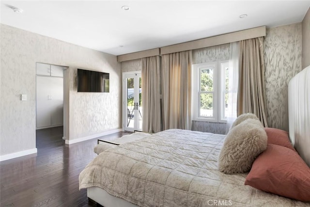 bedroom featuring hardwood / wood-style flooring and access to exterior