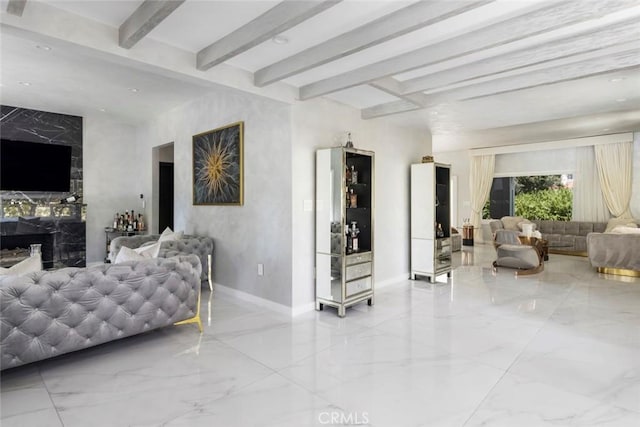 living room featuring beamed ceiling