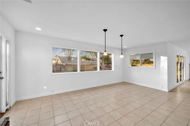 unfurnished room with light tile patterned floors