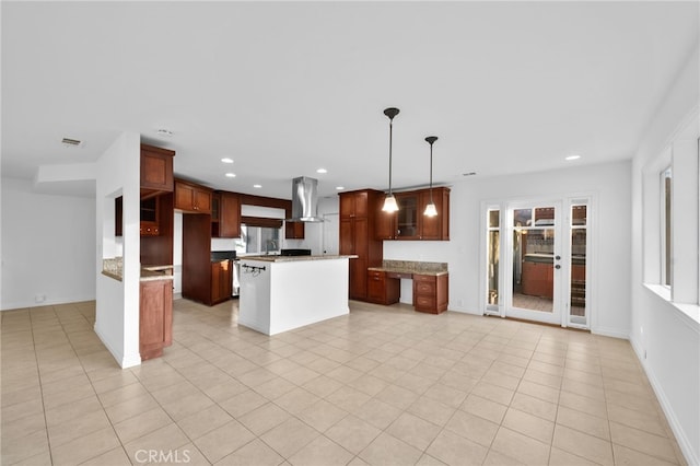 kitchen featuring a kitchen island, island range hood, hanging light fixtures, light tile patterned floors, and light stone countertops