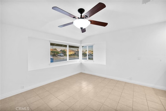 spare room featuring ceiling fan and lofted ceiling