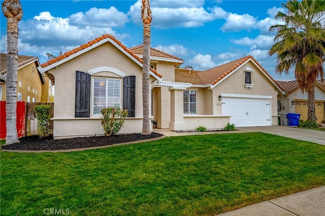 mediterranean / spanish-style home with a garage and a front yard