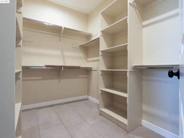 walk in closet featuring light tile patterned floors