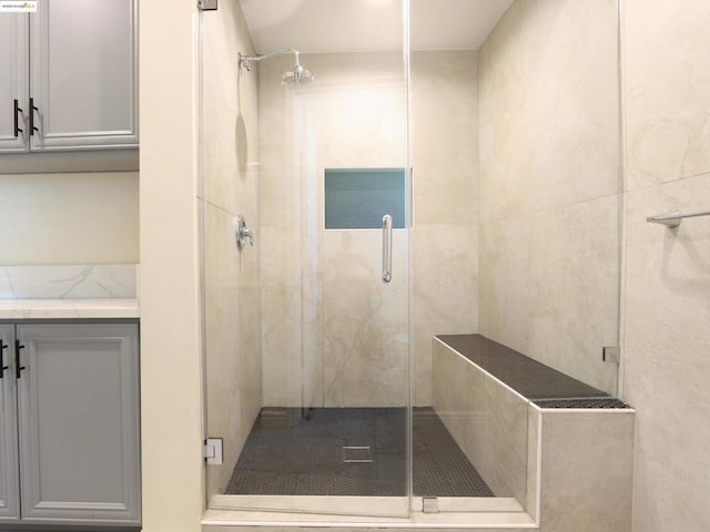 bathroom with a shower with shower door