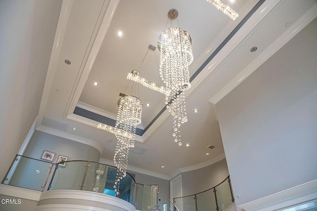 room details featuring a notable chandelier and crown molding