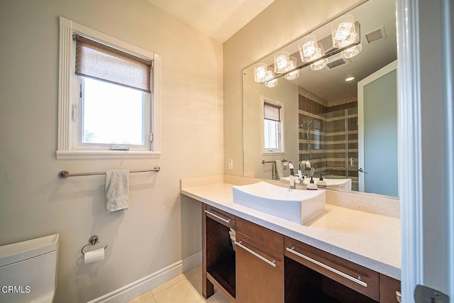 bathroom with vanity, a shower with door, tile patterned floors, and toilet