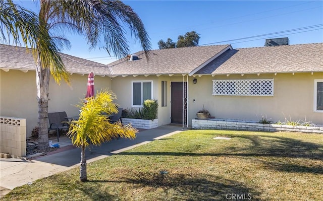 ranch-style house featuring a front yard