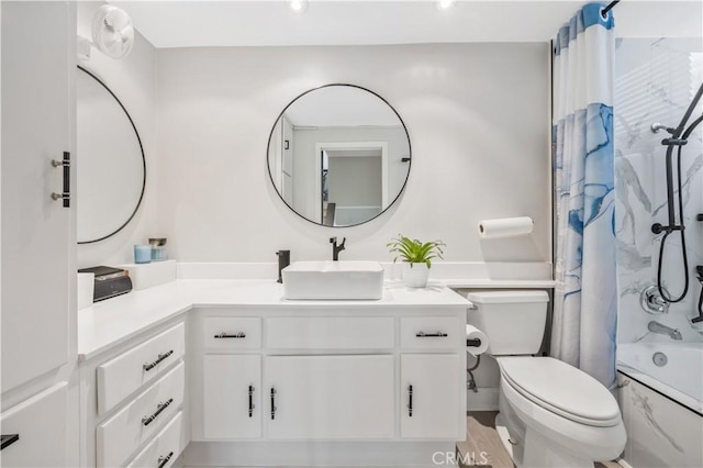 full bathroom featuring vanity, toilet, and shower / bath combo with shower curtain