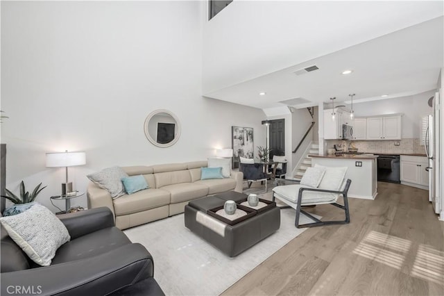 living room with light hardwood / wood-style flooring