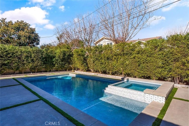 view of pool with an in ground hot tub