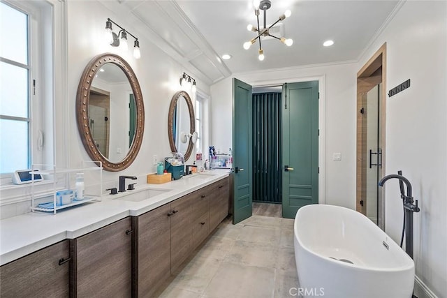 bathroom with vanity, a wealth of natural light, independent shower and bath, and a chandelier