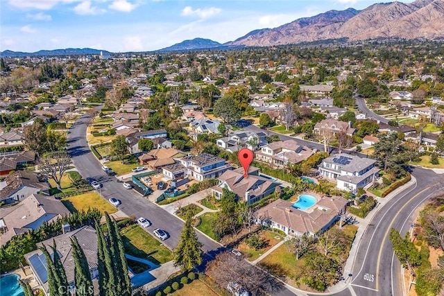 birds eye view of property with a mountain view