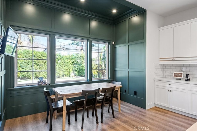 dining space with light wood-type flooring