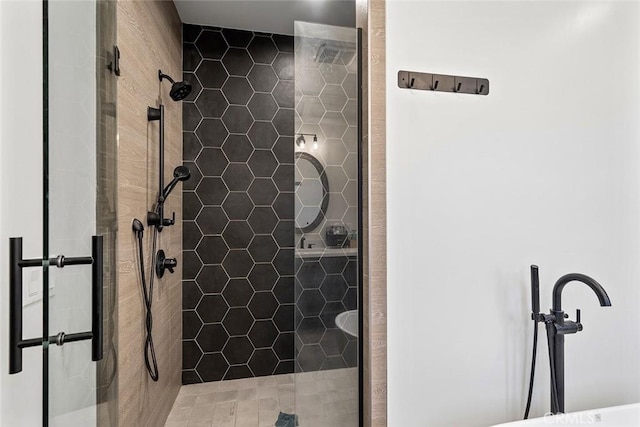 bathroom with a shower with shower door