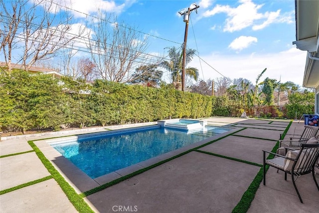 view of pool featuring an in ground hot tub and a patio area