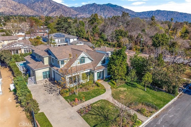 birds eye view of property with a mountain view