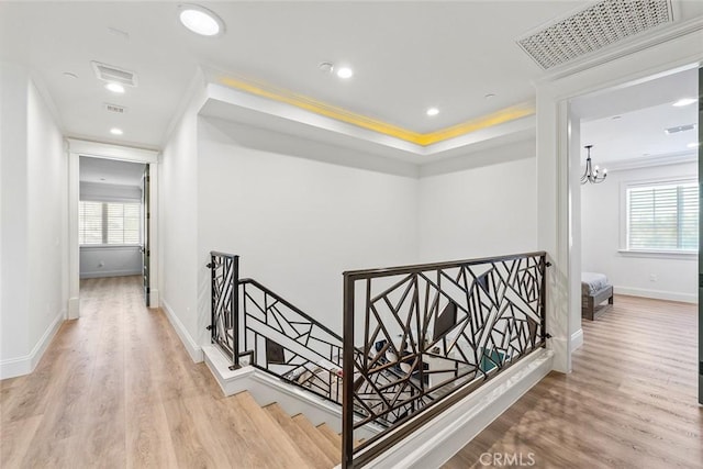 hallway featuring crown molding and hardwood / wood-style flooring