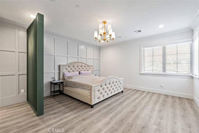 bedroom featuring crown molding, an inviting chandelier, and light wood-type flooring