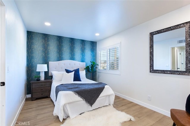 bedroom with light wood-type flooring