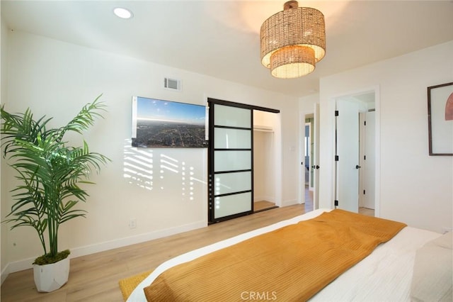 bedroom with light wood-type flooring