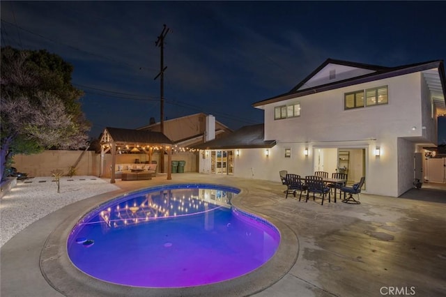 view of pool with a gazebo, an outdoor hangout area, and a patio area