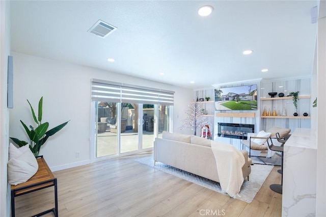 living room with light hardwood / wood-style flooring