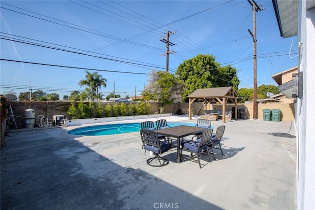 view of swimming pool with a gazebo and a patio area