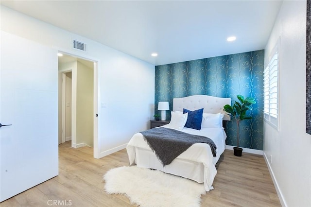 bedroom featuring light wood-type flooring