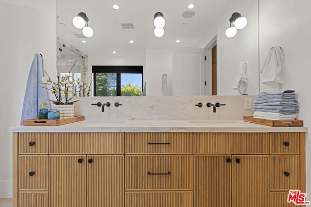 bathroom featuring vanity and walk in shower