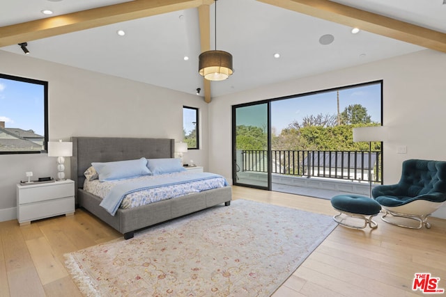 bedroom featuring access to exterior, lofted ceiling with beams, and light hardwood / wood-style flooring