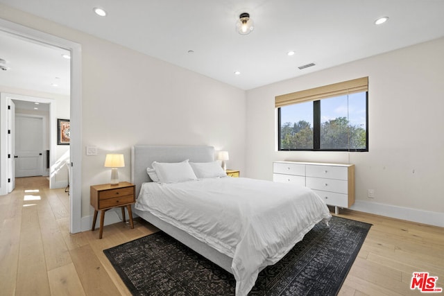 bedroom with light hardwood / wood-style floors