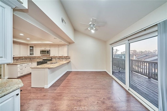 kitchen featuring white cabinetry, appliances with stainless steel finishes, sink, and hardwood / wood-style floors