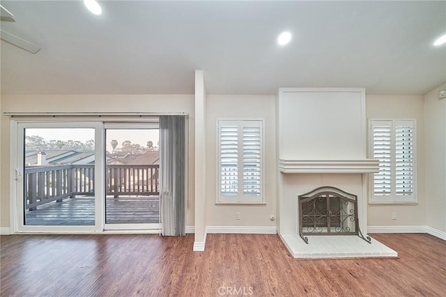 unfurnished living room featuring hardwood / wood-style floors