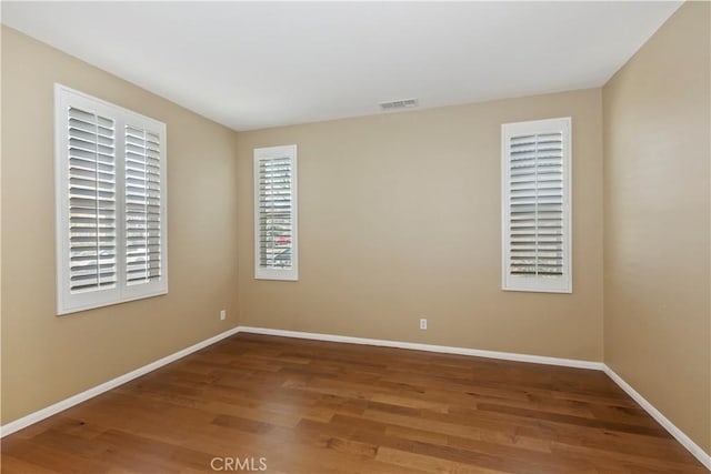 unfurnished room featuring wood-type flooring