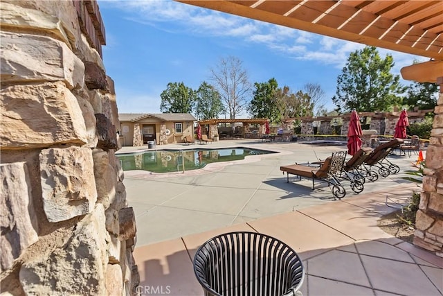 view of pool featuring a patio area and a pergola