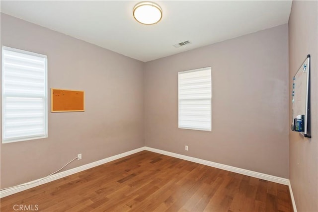 empty room featuring hardwood / wood-style floors