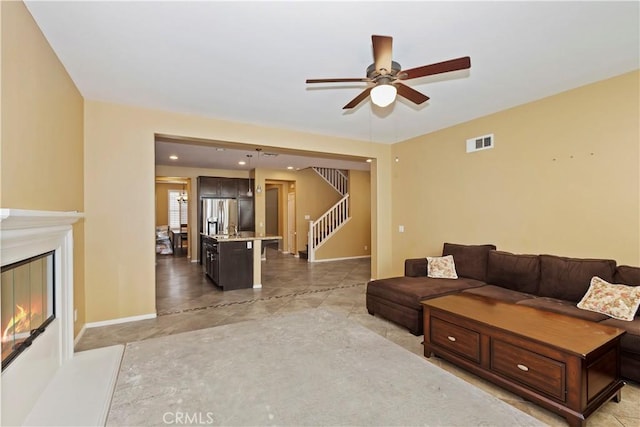 living room with ceiling fan