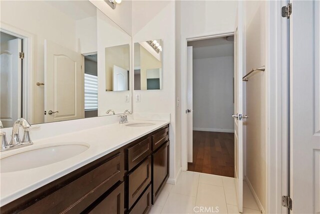 bathroom with tile patterned flooring and vanity