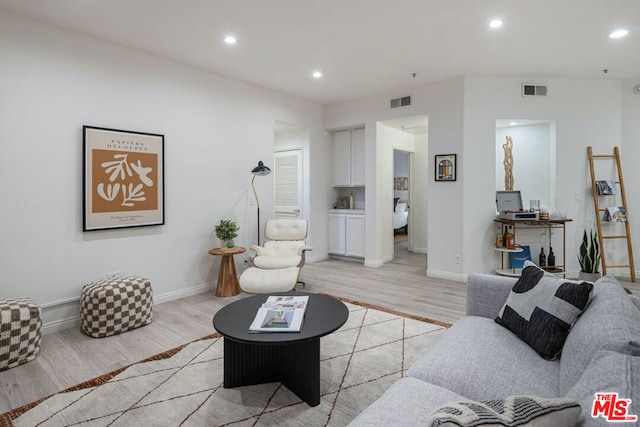 living room with light hardwood / wood-style floors