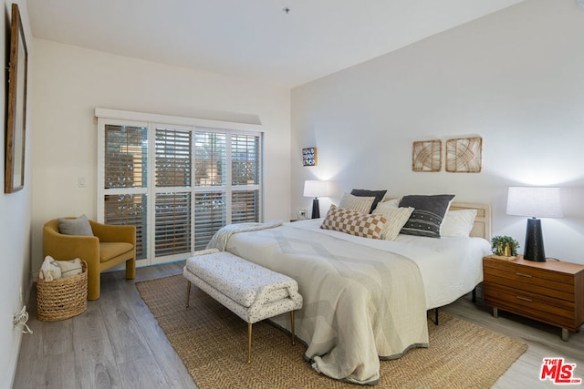 bedroom with light hardwood / wood-style floors