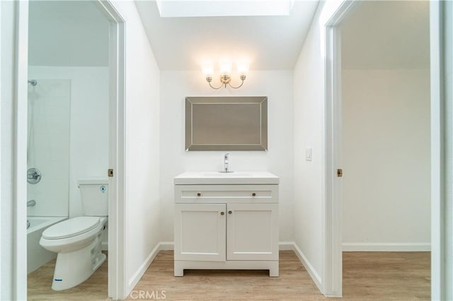 full bathroom with vanity, shower / bathing tub combination, hardwood / wood-style flooring, and toilet